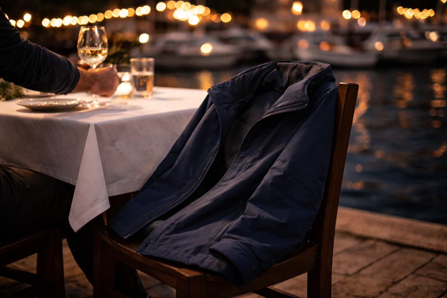 Dinner - jacket on the chair, harbour lights